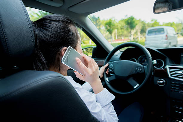 istock Asian woman driving a car and calling 485371122