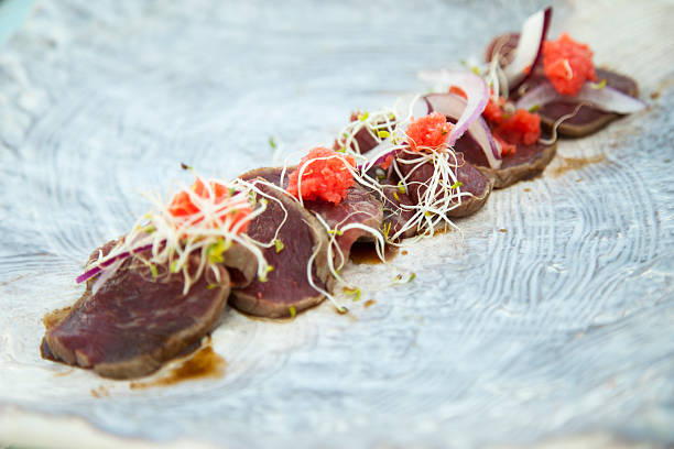 A plate of hi end sushi based on seared tuna.