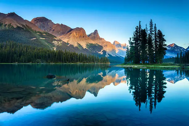 The world-famous Spirit Island and Maligne Lake at dusk. Jasper National Park, Alberta, Canada.