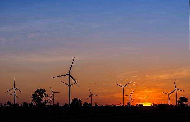istock Eco power in wind turbine farm with sunset 485371824