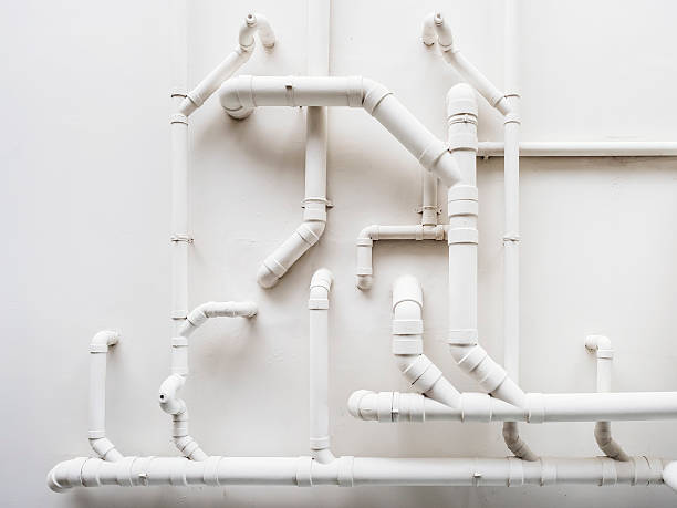 Pipeline Plumbing system on white wall stock photo