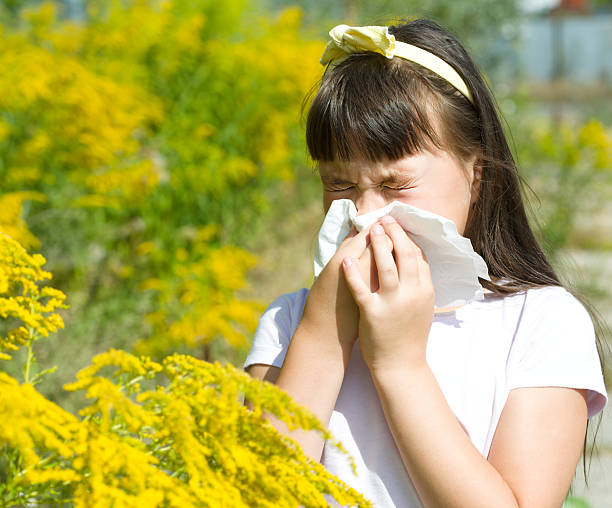 istock Girl is blowing her nose 485372252
