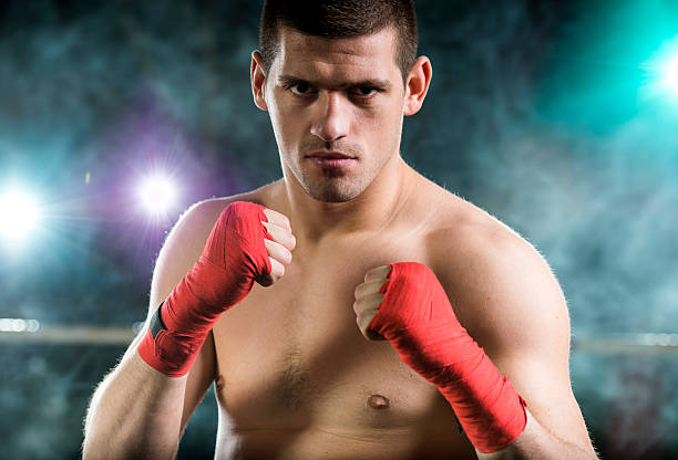 istock Serious young boxer in looking at the camera. 485372432