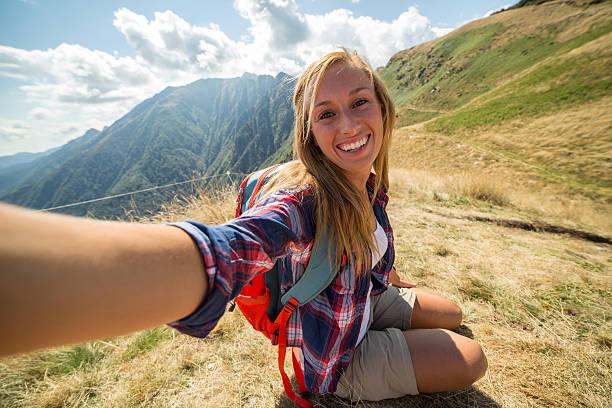istock Hiker woman taking selfie on mountain top 485372508
