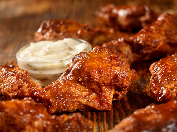 BBQ Sauce Chicken Wings BBQ Sauce Chicken Wings -Photographed on Hasselblad H3D2-39mb Camera ranch dressing stock pictures, royalty-free photos & images