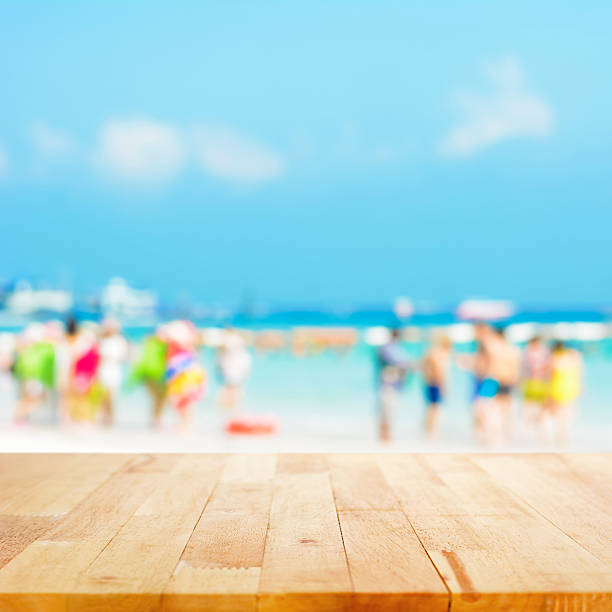 istock Table top on blurred background of people at the beach 485374154