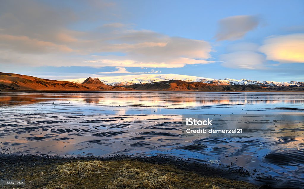 Approach to Dyrholaey, View of Myrdalsjokull Approach to Dyrholaey at sunrise, Southern Iceland with Myrdalsjokull Glacier in the background. Architectural Column Stock Photo