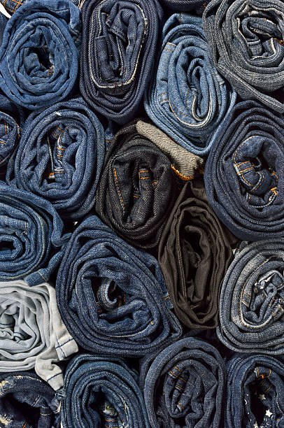 istock Lot of different blue jeans close-up 485375348