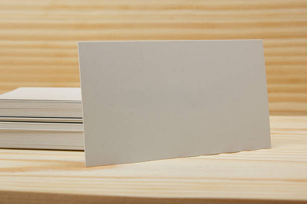 istock Blank white business cards on wood background 485375362