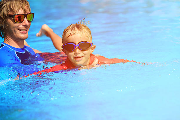 istock Father teaching his son to swim 485375436