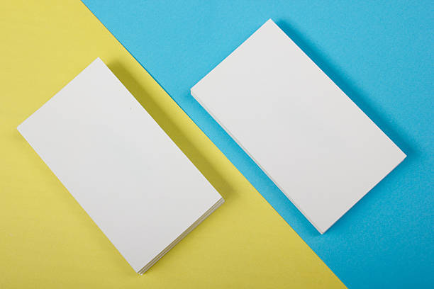 istock Blank white business cards on color background 485375506