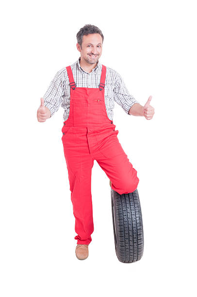 istock Mechanic with tire showing thumbs up or like gesture 485375930