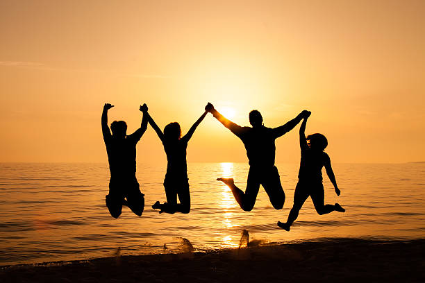istock Four friends jumping on the beach 485376717