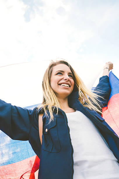istock Cheering Woman Under Russian Flag 485376968