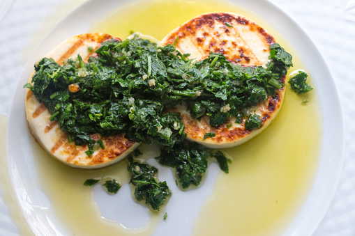 Halloumi cheese with parsley, onion and olive oil.