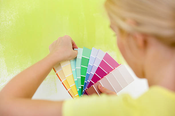 istock Woman choosing color for wall 485377347