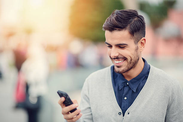 istock Business man texting on smartphone outside 485377974