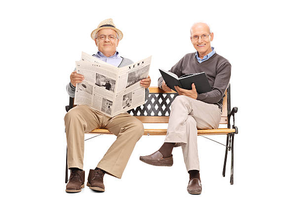 istock Two seniors sitting on a wooden bench 485380986