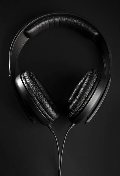 istock Black Headphones on a black background 485381598
