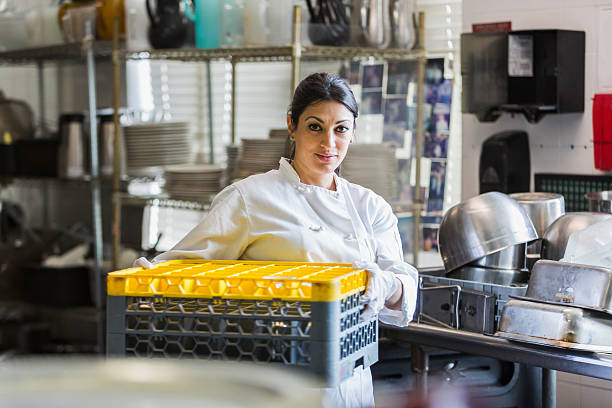 woman working in commercial kitchen - dishwasher cooking bildbanksfoton och bilder