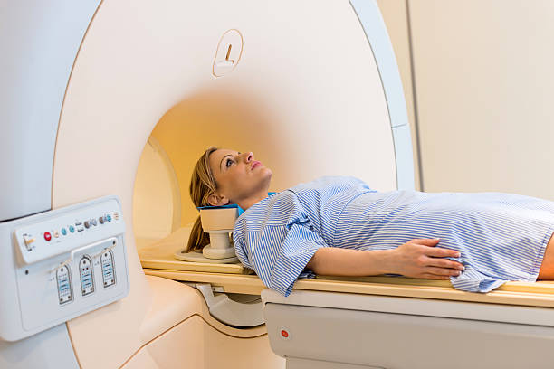 istock Female patient about to receive MRI scan. 485382308