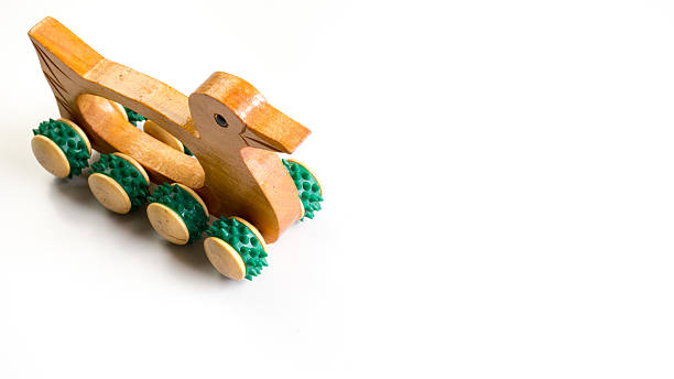 istock Wooden duck shape massage roller hand held massager tool 485387386