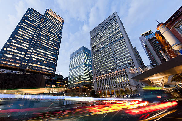istock Tokyo office buildings and traffic at dusk 485393160