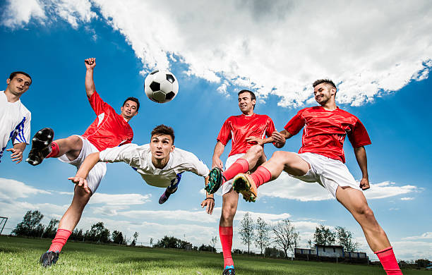 istock Soccer player heading the ball during a match. 485393704