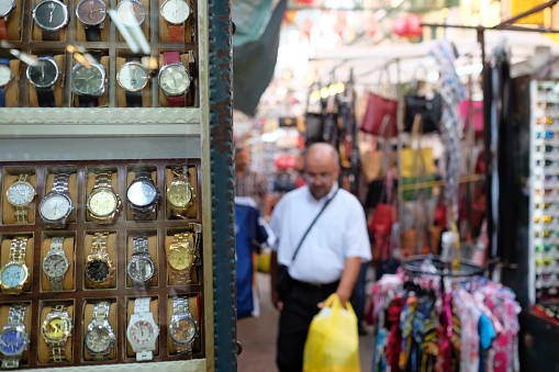 Kuala Lumpur, Malaysia - August 19, 2015: Some fake watch on sale in China Town market in Kuala Lumpur. In this area it is full of small shops selling a plenty of counterfeit merchandise illegally. This area is popular among tourist, and sometimes they are not aware that buying these fake goods is illegal and may lead to problems at the customs.