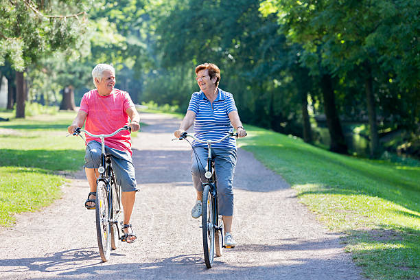 istock Senior couple with bicycle having fun 485394374