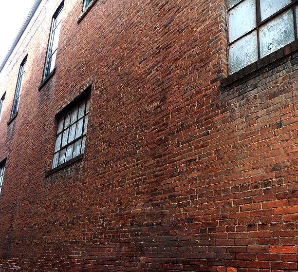 istock Weathered Red Brick Wall of an Old Historic Building 485394452