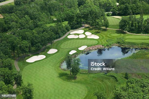 Aerial View Of Golf Green With Traps Pond And Trees Stock Photo - Download Image Now