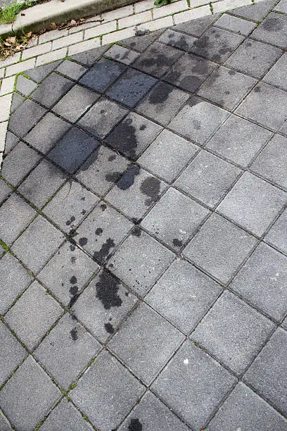Oil stain, spill on a parkingspot, parkingplace, street, car motor, bike, truck