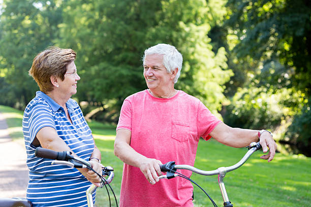 istock Senior couple with bicycle having fun 485404534