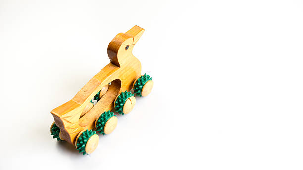 istock Wooden duck shape massage roller hand held massager tool 485404744
