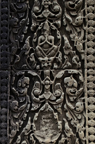 istock carved sandstone of hermit at Banteay Samre 485405172