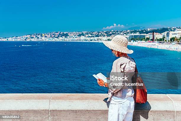 Tourist In Nice France Stock Photo - Download Image Now - Nice - France, Guidebook, France