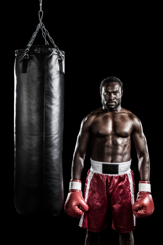 Boxer beside punching bag
