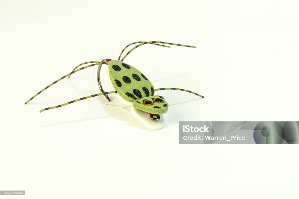 Spotted Frog Fishing Lure Imitation green spotted frog fishing lure on white background. Animal Body Part Stock Photo