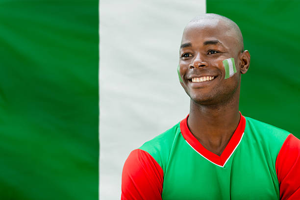 Soccer fan from Nigeria looking very happy