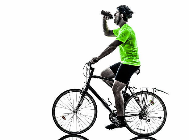 istock man bicycling mountain bike drinking silhouette 485411565