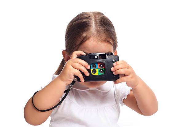 Cute girl shooting a photograph