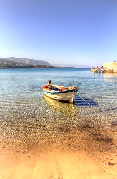 Boat Single boat at the beach of Cefalu, Sicily cefalu stock pictures, royalty-free photos & images