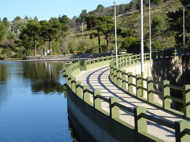 Reservoir at San Jerónimo Dam Bridge over stagnant water of San Jerónimo dam in La Cumbre, Córdoba, Argentina tarde stock pictures, royalty-free photos & images