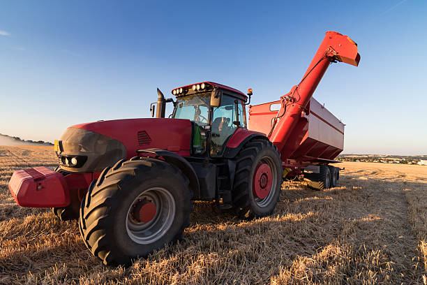 istock Agriculture tractor on a stubble field 485412498