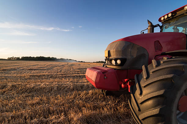 istock Agriculture tractor on a stubble field 485412502