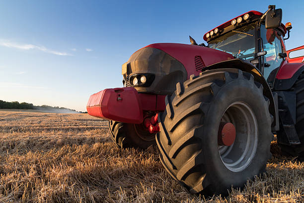 istock Agriculture tractor on a  stubble field 485412524