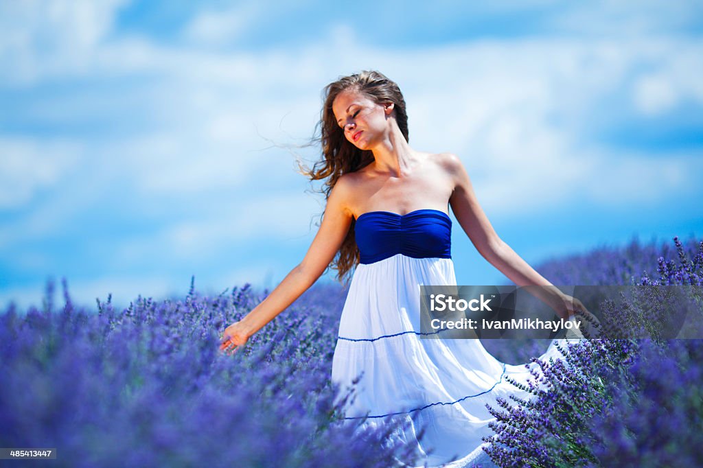 Woman dancing on a lavender field Adult Stock Photo