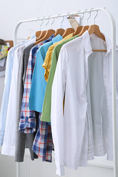 istock Clothes hang on a shelf in designer clothes store 485415584
