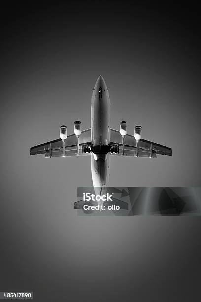 Landing Airplane At Dusk View From Directly Below Stock Photo - Download Image Now - 2015, Airplane, Airport